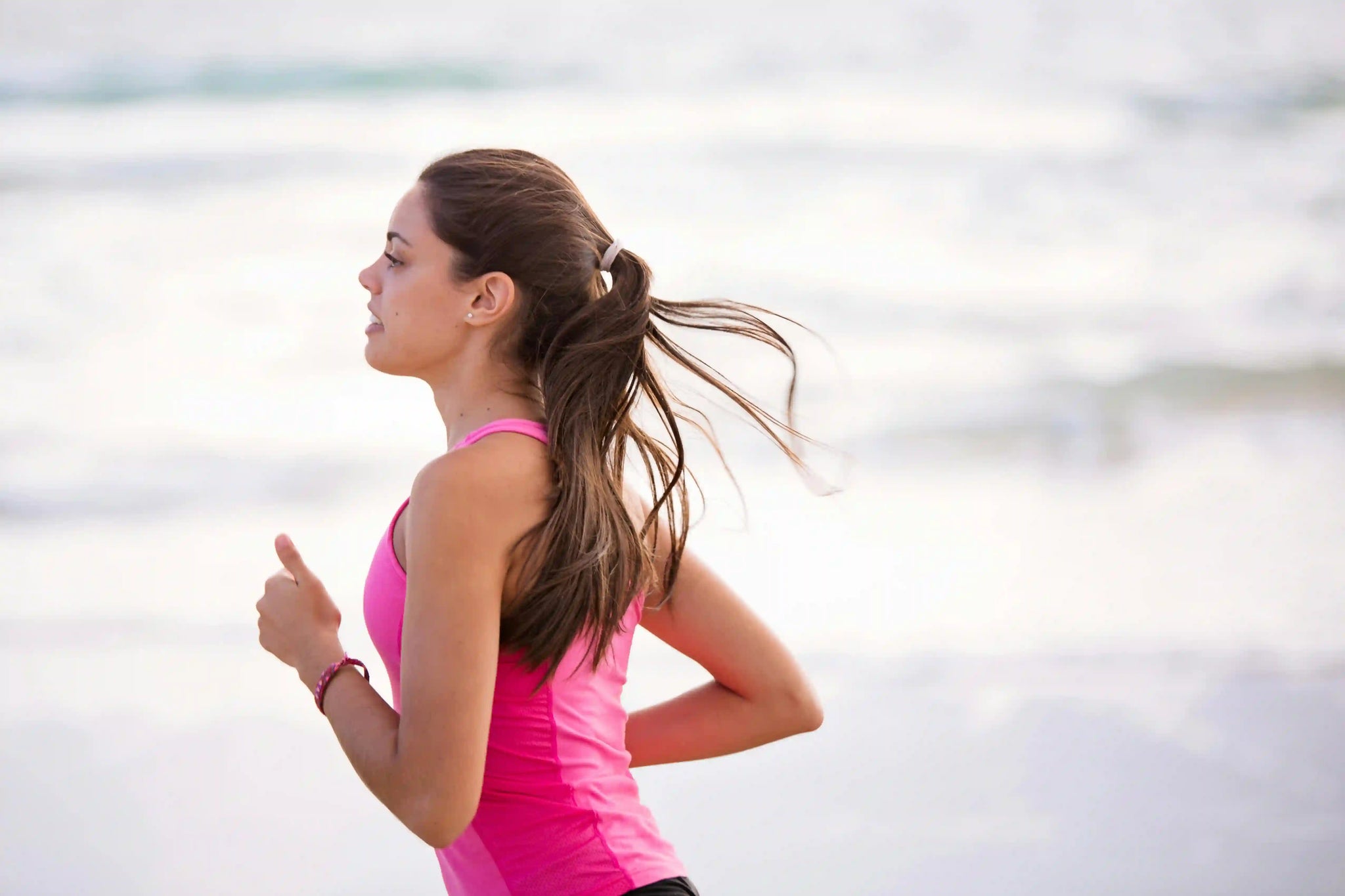 Woman running at the beach