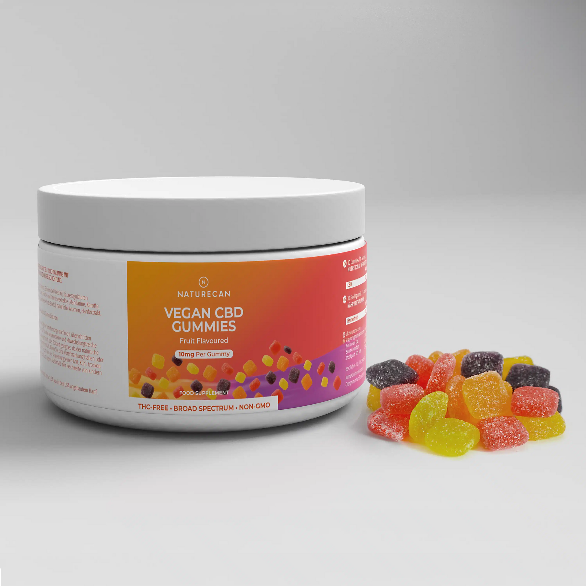 A jar of Vegan CBD Gummies with a colorful fruit-flavored label and assorted gummies beside it.