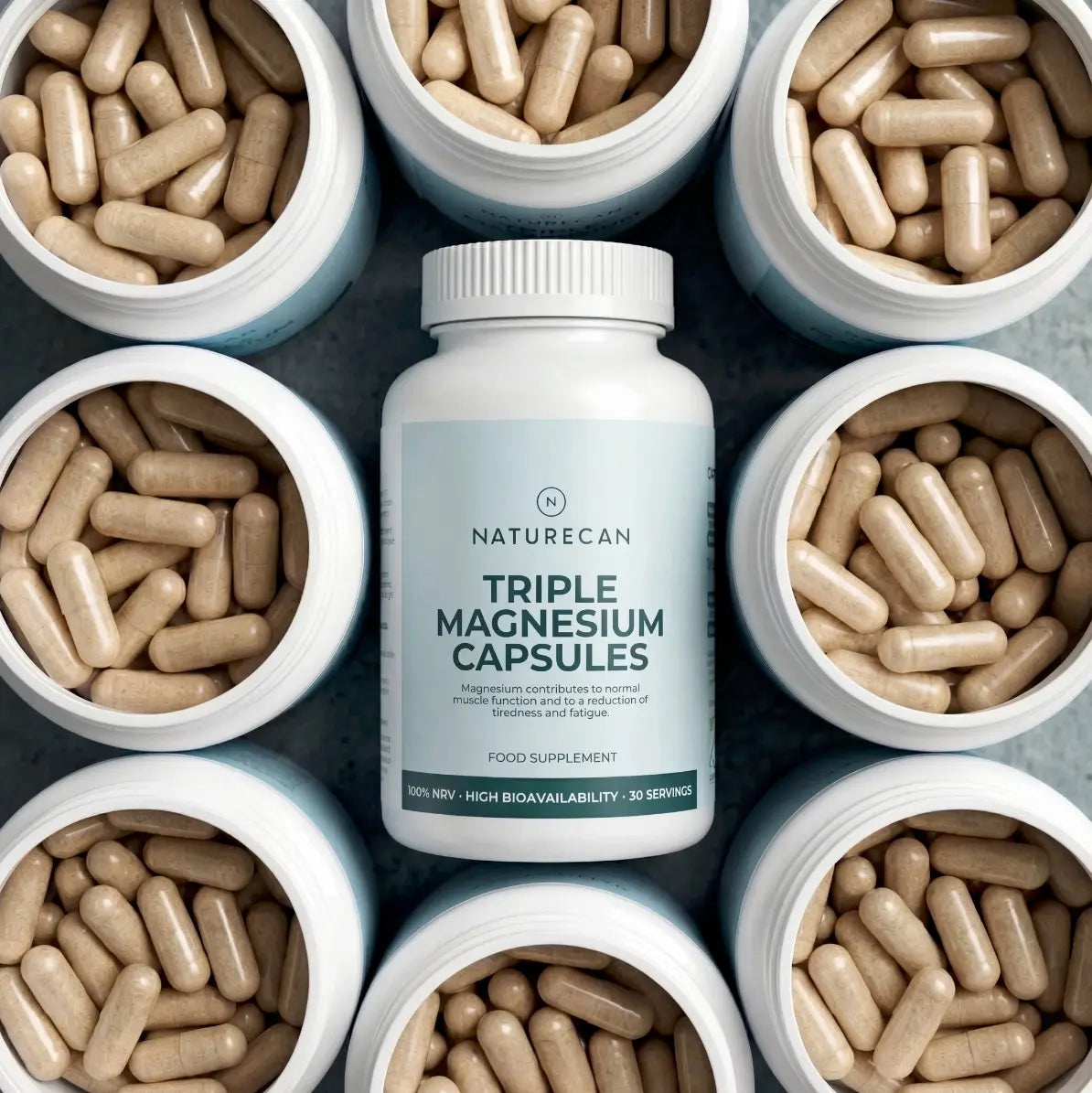 A bottle of Naturecan Triple Magnesium Capsules surrounded by open jars filled with beige capsules.