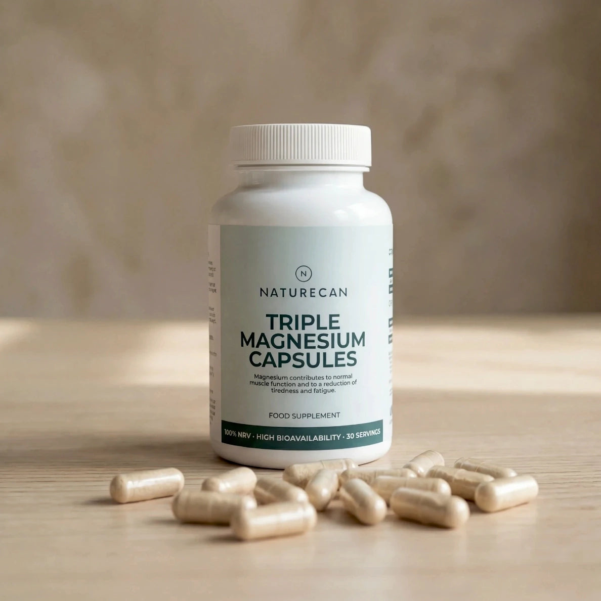 A bottle of Naturecan Triple Magnesium Capsules with visible capsules scattered on a wooden surface.