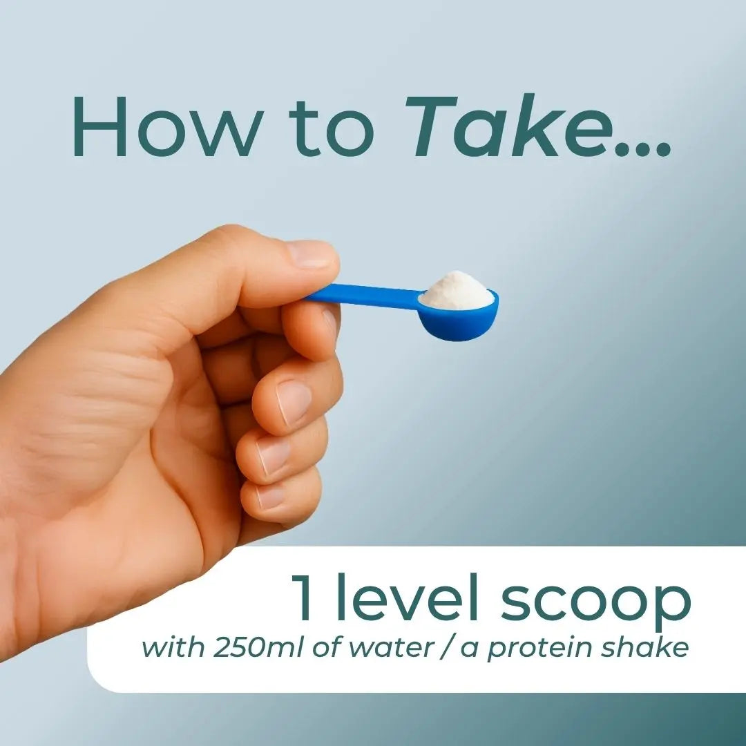 A hand holding a blue scoop of powder with text instructions for mixing with water or a protein shake.