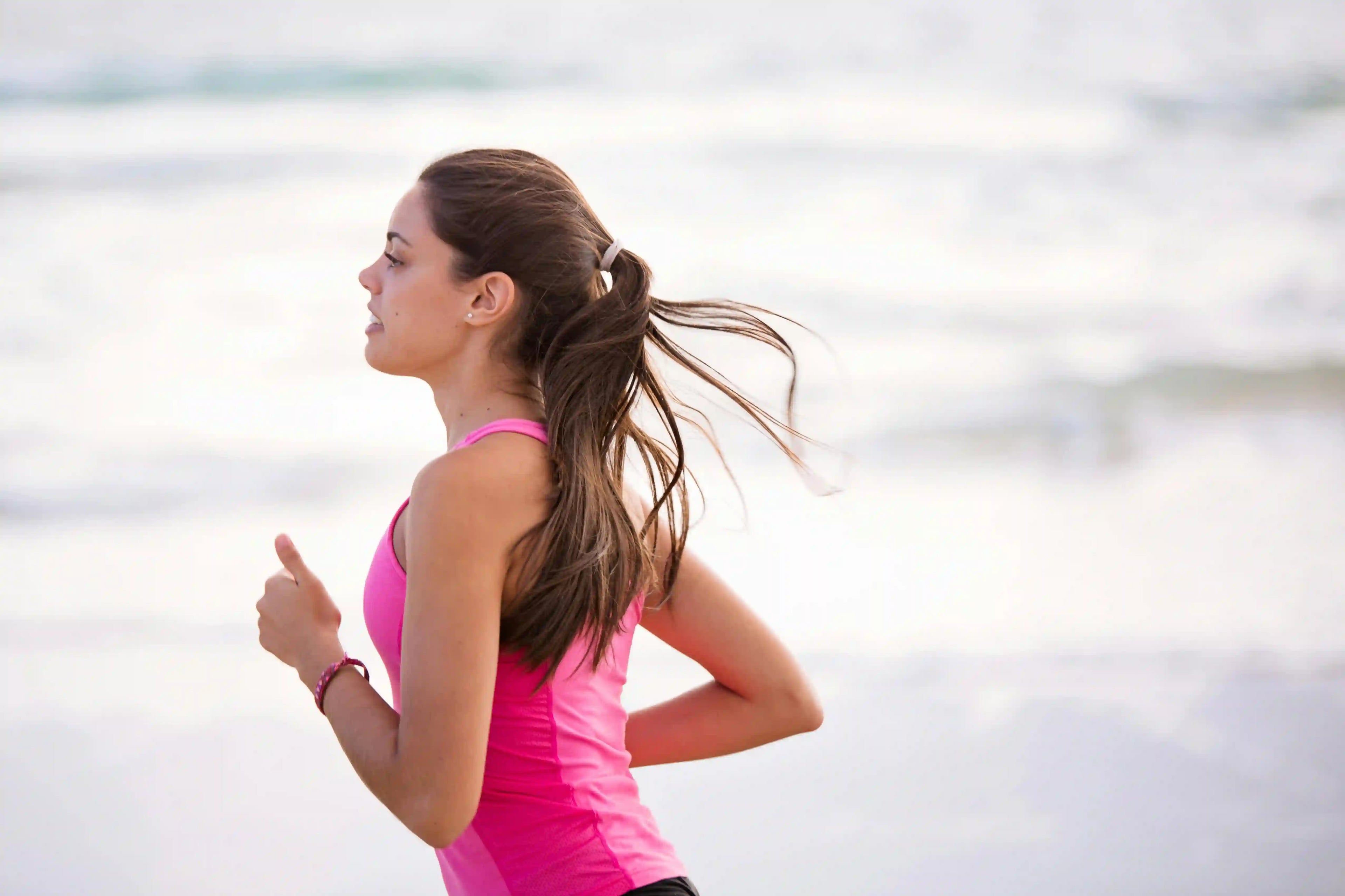 Woman running at the beach