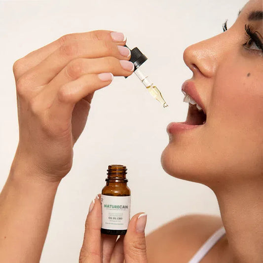 woman taking cbd oil for its benefits