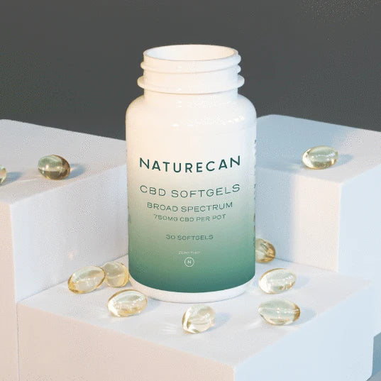 Naturecan Vegan CBD Capsules softgels spread around bottle