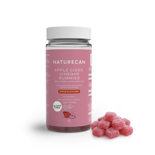 A jar of Naturecan Apple Cider Vinegar Gummies with a pile of pink gummies beside it.