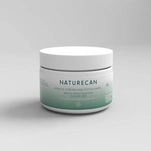 A jar of CBD Arnica Cream with Witch Hazel, featuring 1000mg broad-spectrum CBD on the label.
