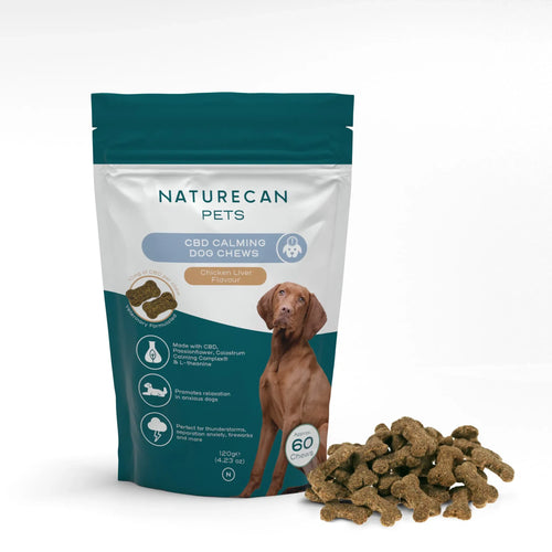 Packaged CBD Dog Treats for Calm with chicken liver flavor and a pile of treats beside it.