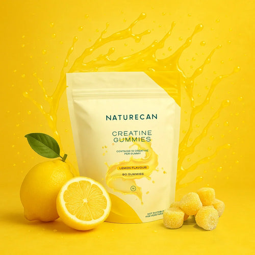 Naturecan Creatine Gummies in a yellow pouch with lemon flavor and whole and sliced lemons beside it.