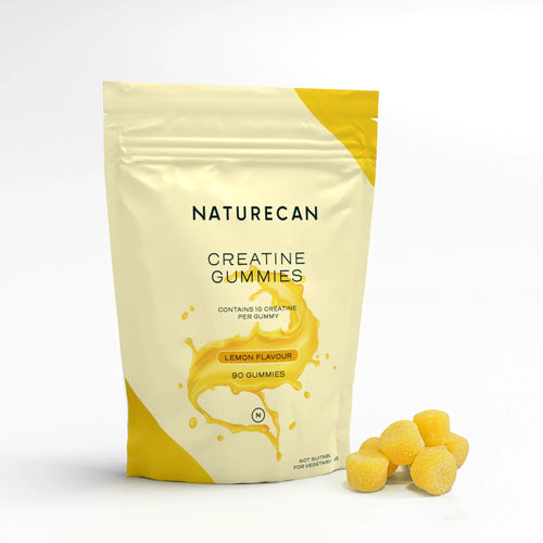 Naturecan Creatine Gummies in a yellow pouch with lemon flavor and a few gummies beside it.
