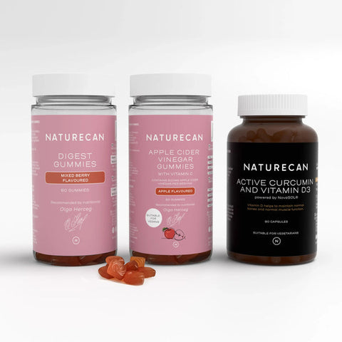 Three Naturecan bottles labeled Digest Gummies, Apple Cider Vinegar Gummies, and Active Curcumin and Vitamin D3.