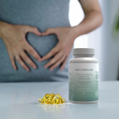 Bottle of High Strength Omega-3 Supplement with softgel capsules and a person forming a heart shape with their hands.
