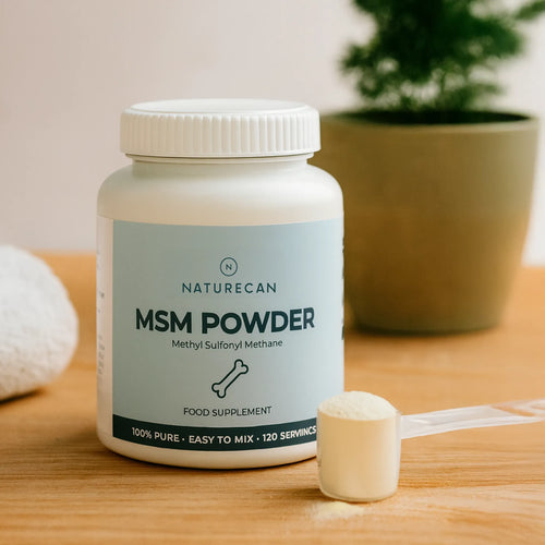 A jar of MSM Powder by Naturecan with a scoop of powder on a wooden surface.