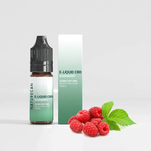 CBD Vape Juice - Raspberry 10ml bottle and box with fresh raspberries and green leaves.