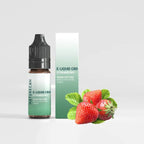 CBD Vape Juice - Strawberry 10ml with a bottle and box, next to ripe strawberries.
