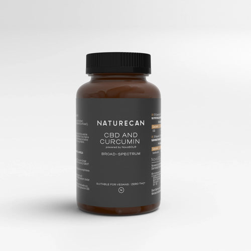 Bottle of Liquid Gold CBD with Curcuminoids, labeled as broad-spectrum and suitable for vegans.