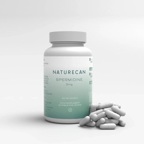 Bottle labeled "Naturecan Spermidine 5mg" with scattered capsules beside it.