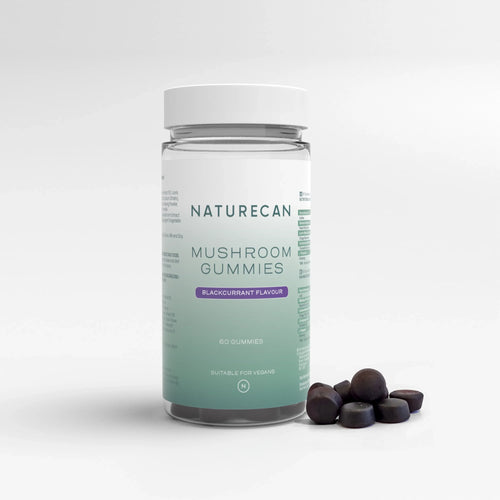 Jar of Mushroom Gummies with "Naturecan" label and blackcurrant flavour, alongside several dark gummies.